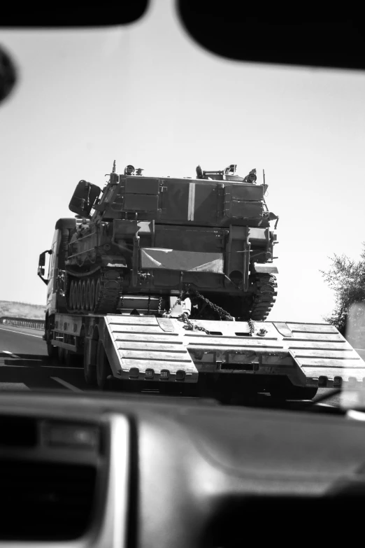 the back of a military vehicle on top of a car bed