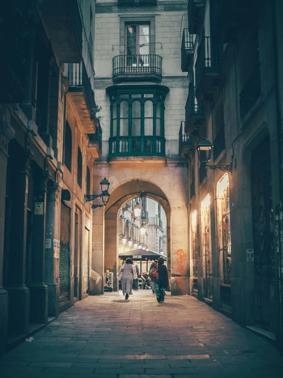 a large building with some old doors and an archway