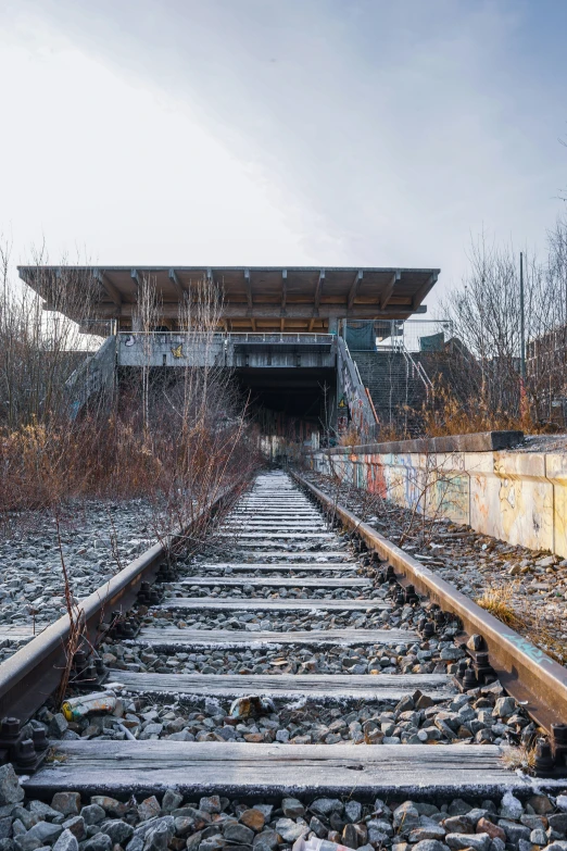 a train track running out of a large building