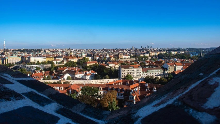 an overview looking down onto a city with a clear blue sky