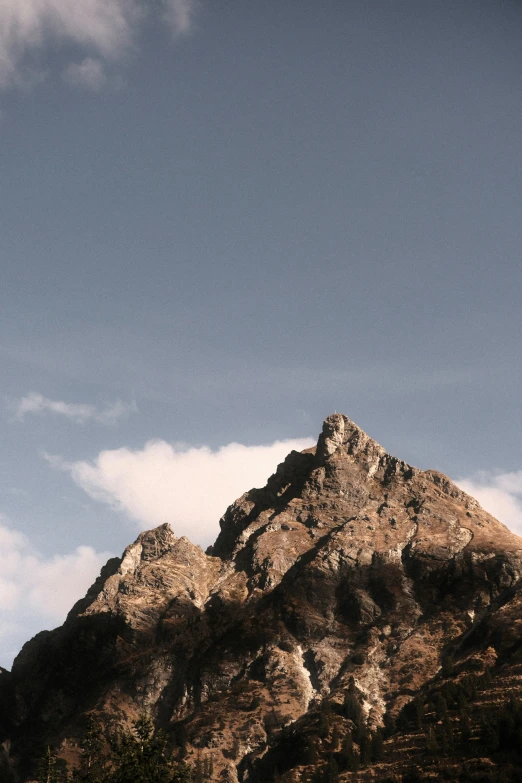 the mountain with a clock tower on it is shown