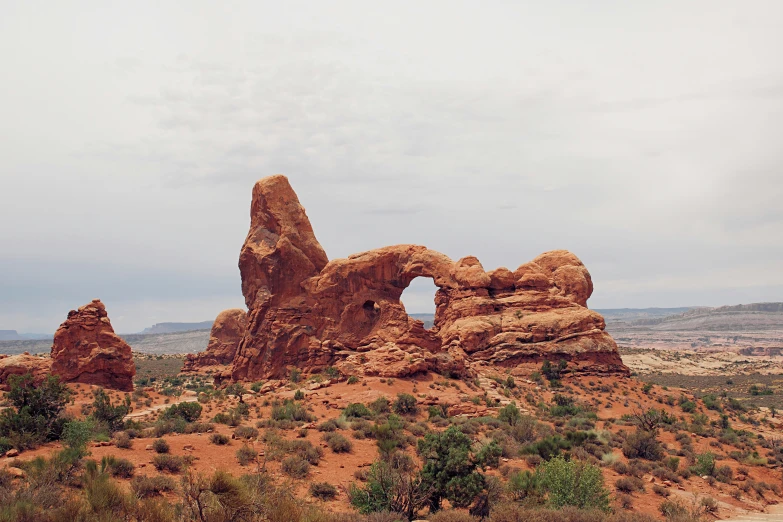 a rock formation on the edge of a desert