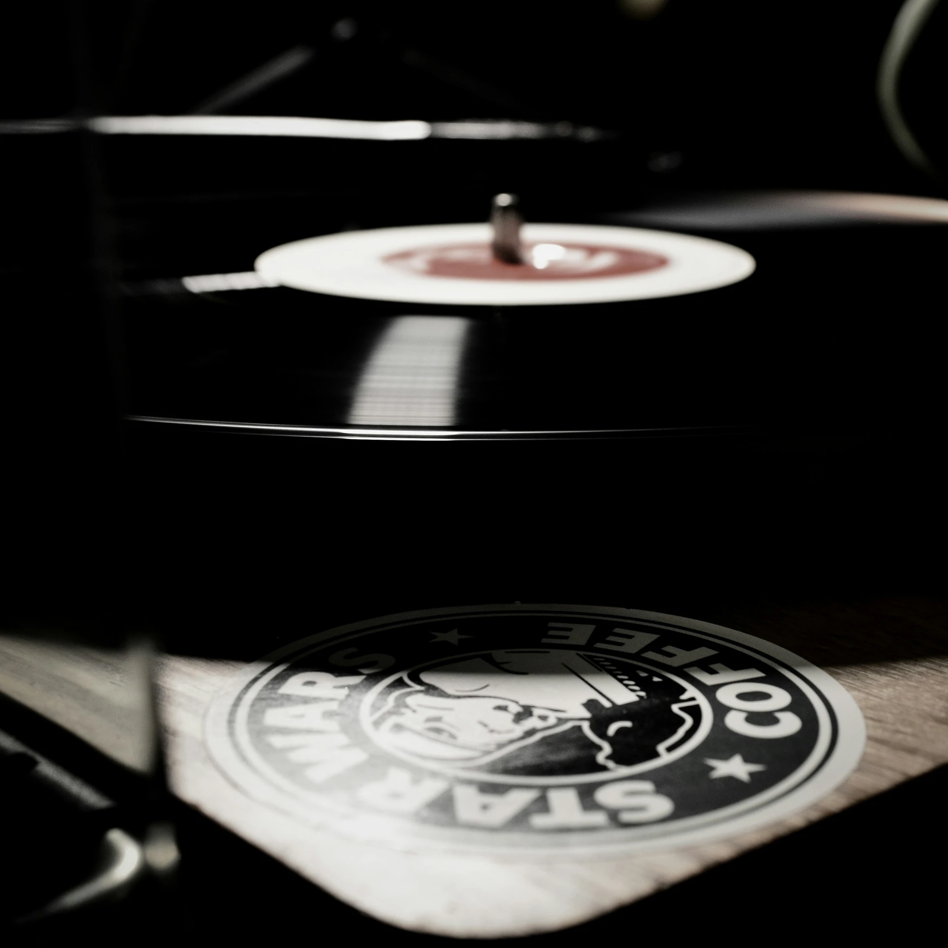 an old record player sits in the spotlight