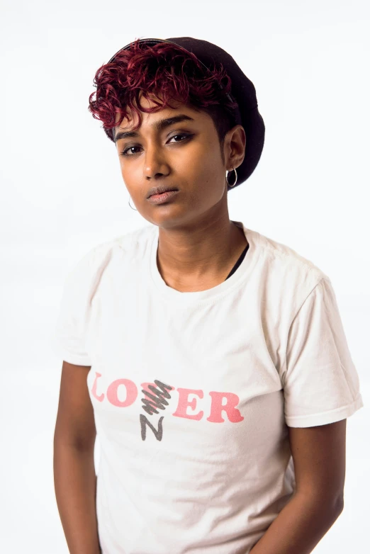 young woman with afro hair standing in a shirt