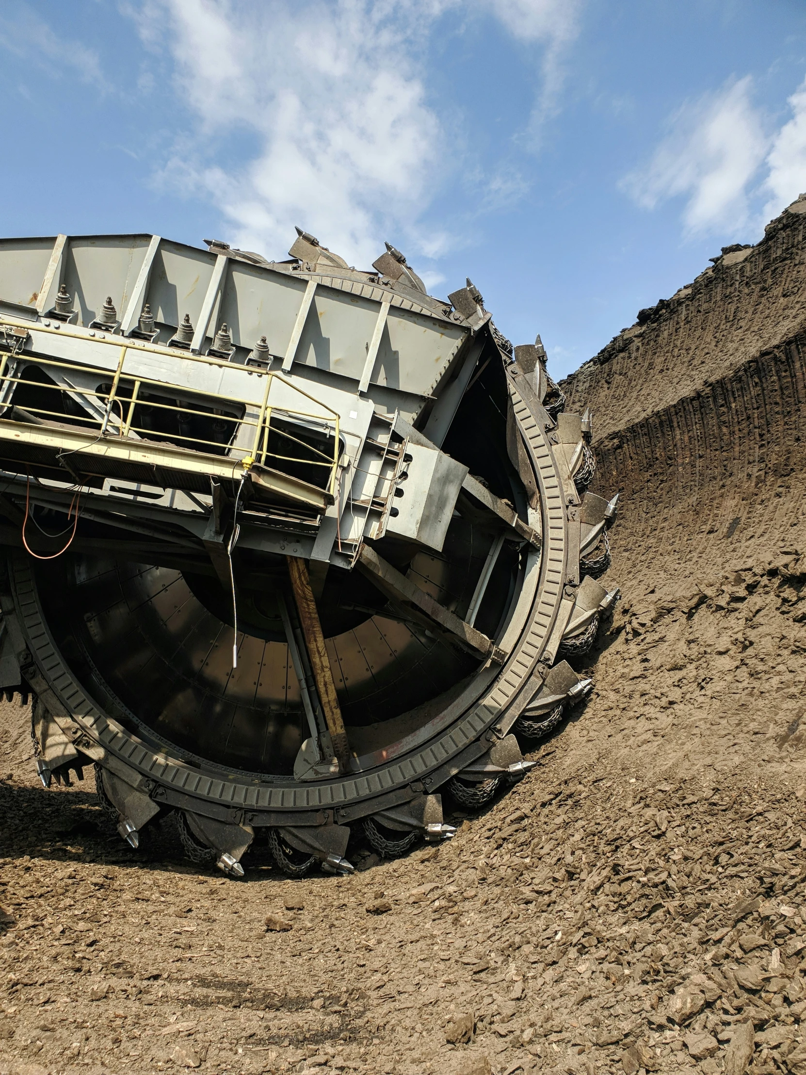 a large metal object in the dirt