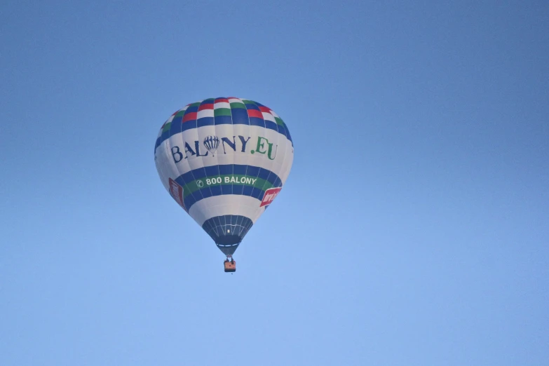 a very colorful  air balloon in the sky