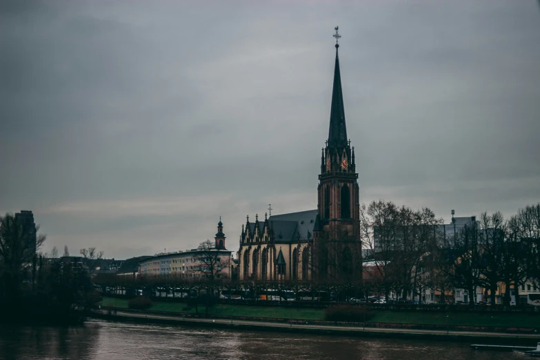 a picture of a tall cathedral and trees