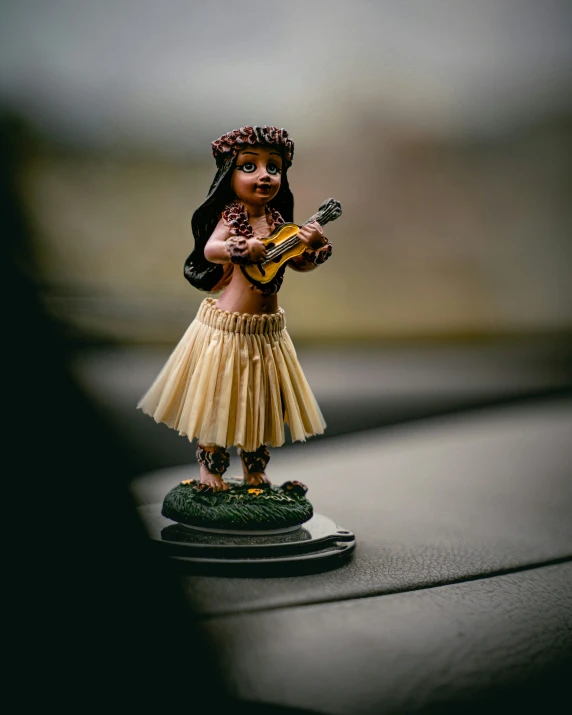 a figurine that looks like a hula girl