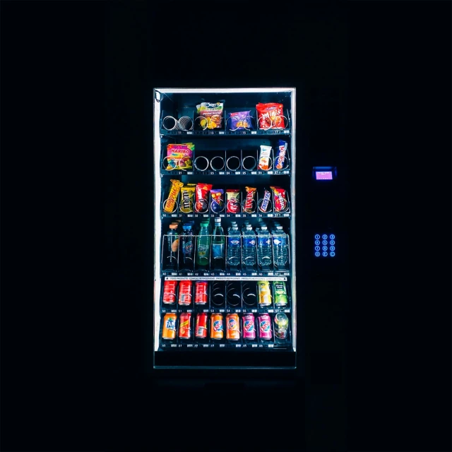 a vending machine in a darkened room