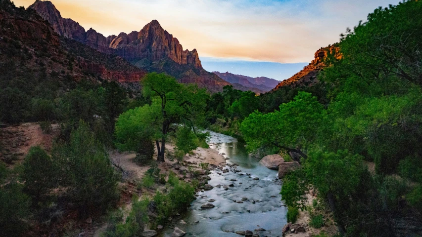 an image of a river flowing through the canyon