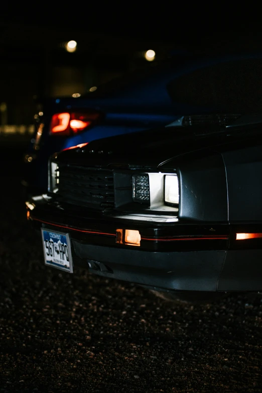 this is a rear view of an automobile parked on a street