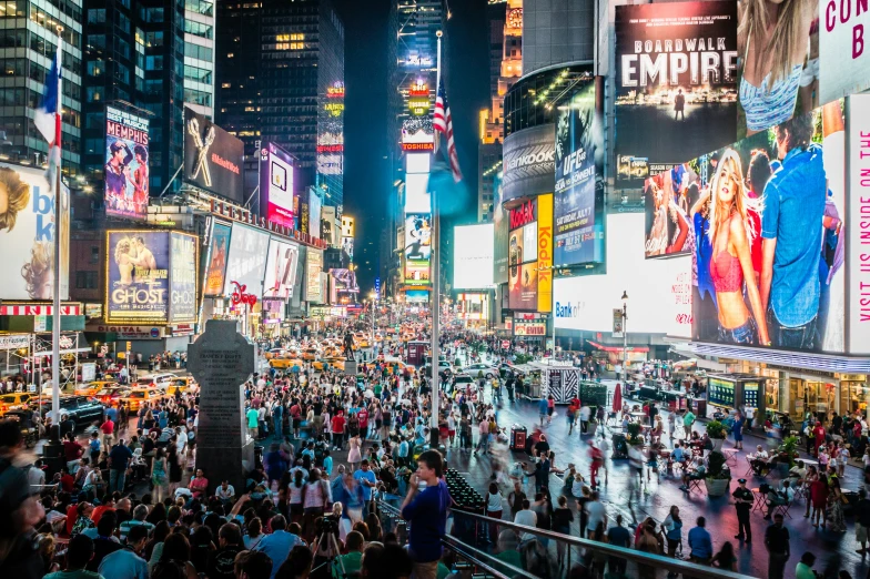 the crowded times square during a busy day in new york city