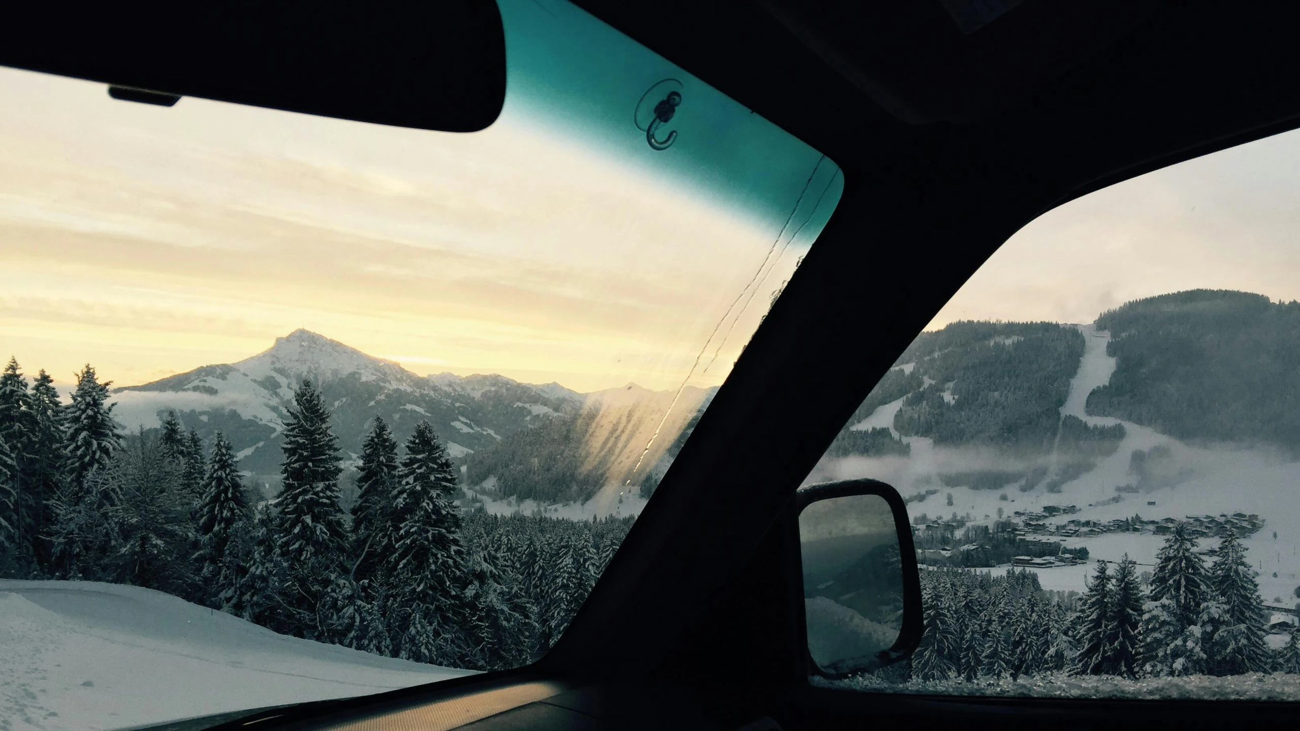 the view from inside the car is looking at the snow