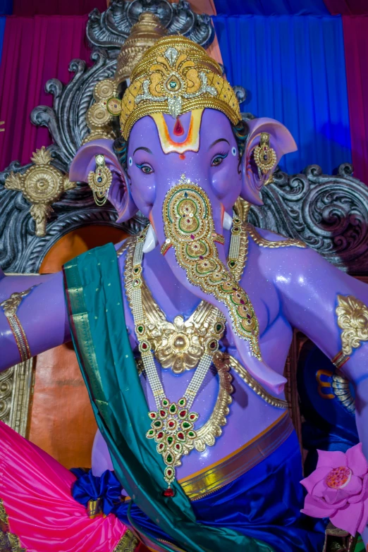 statue of lord ganeshra surrounded by other ornaments