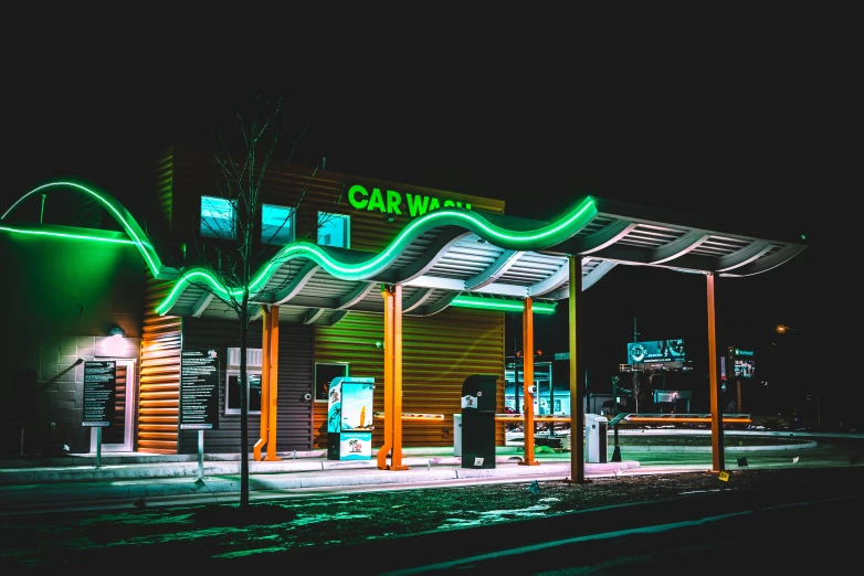 an electric charging station at night with neon green lights