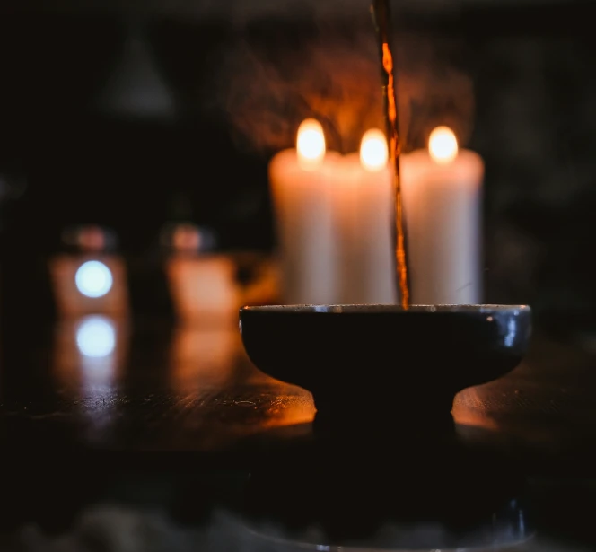 a bunch of candles that are sitting on a table