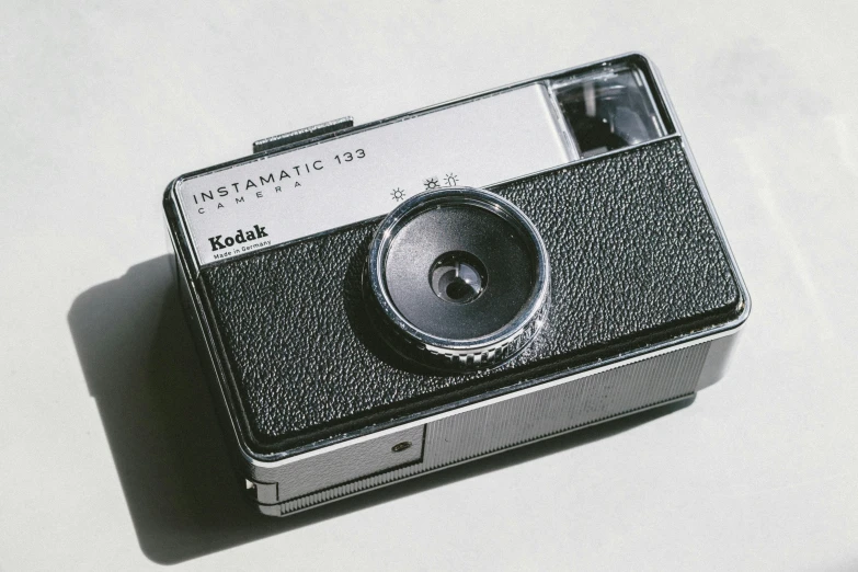 an old po camera sitting on top of a table