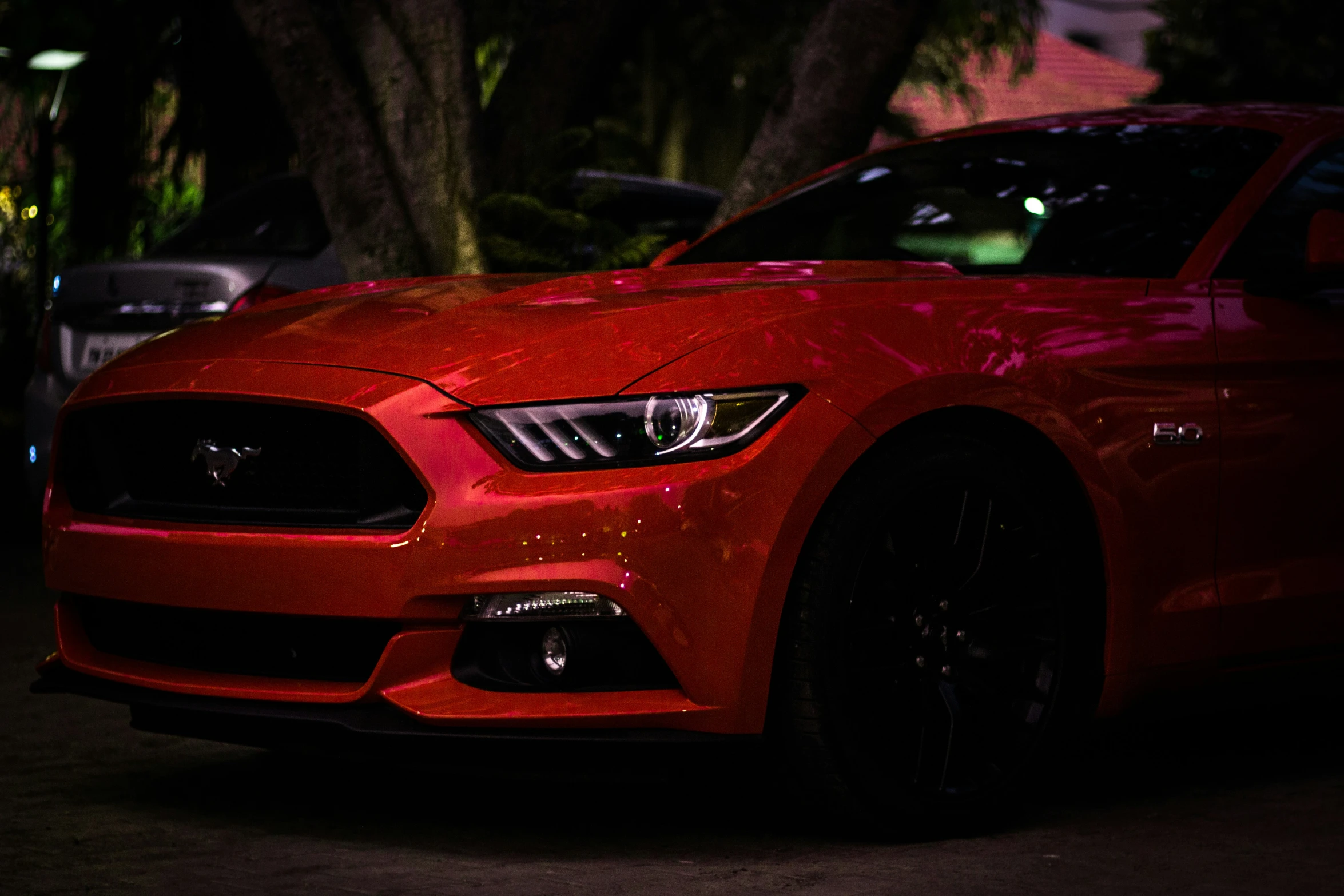 the front view of a red sports car