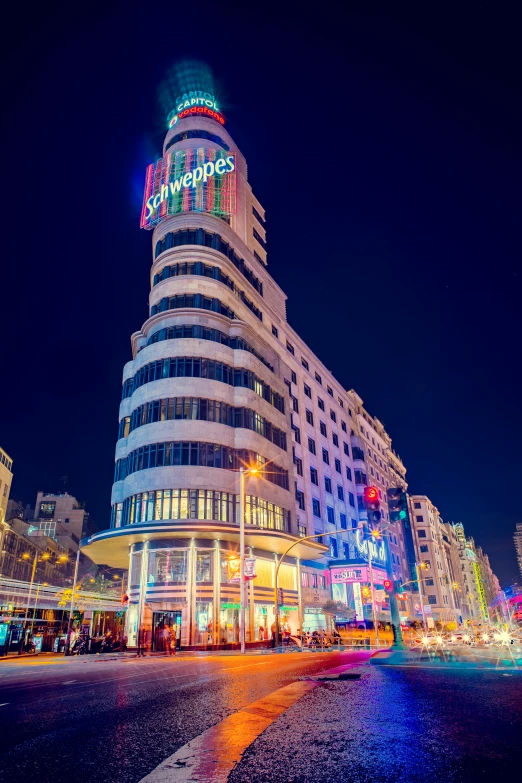 a building on a city street has holiday lights on it