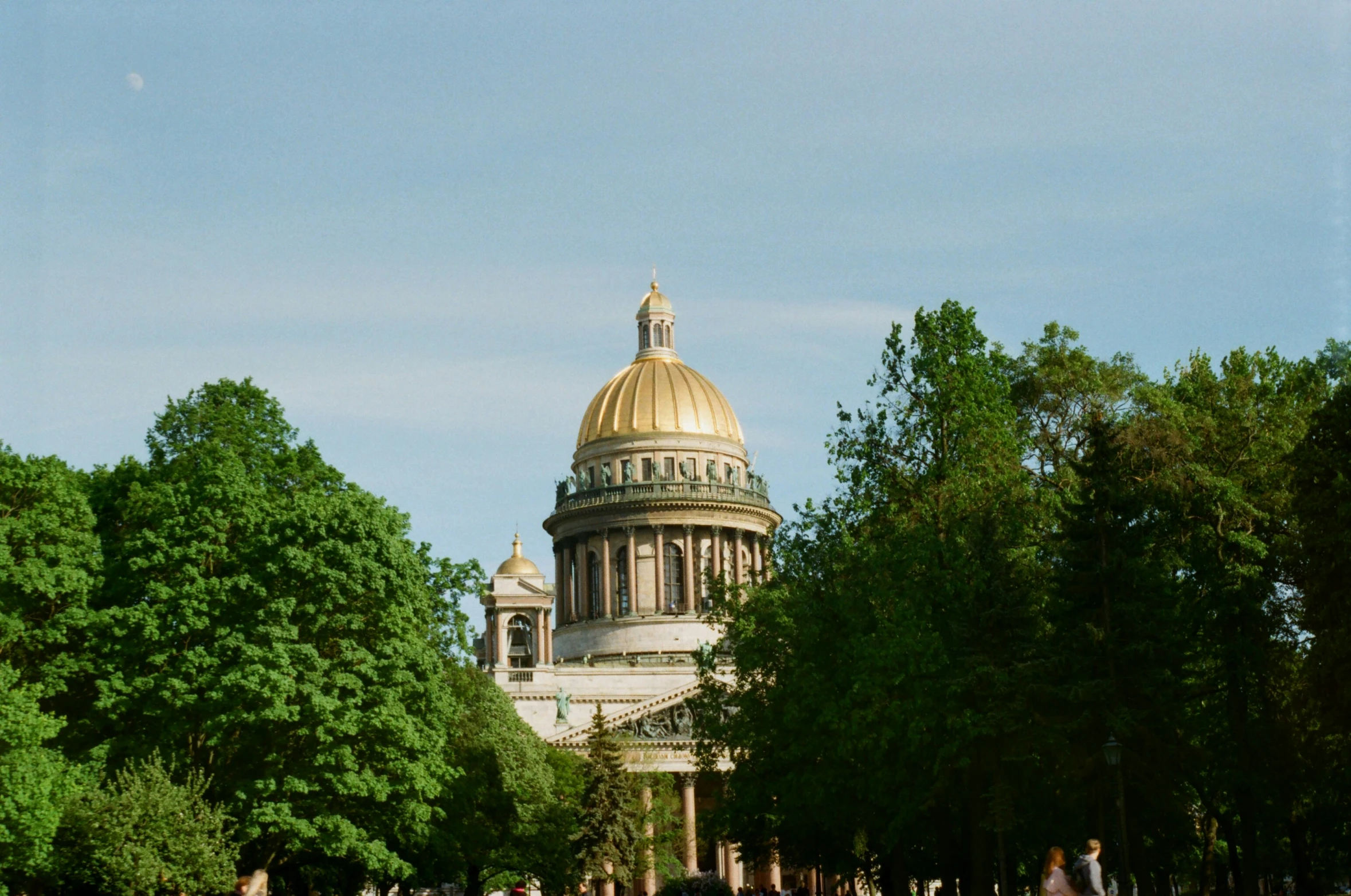 a building with a dome near some trees