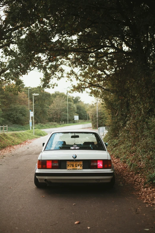 an old car parked on the side of the road