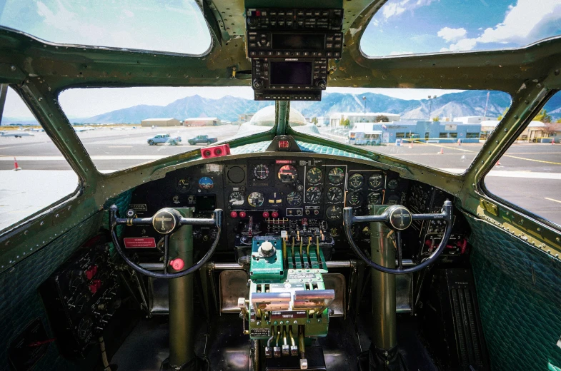 the inside view of an airplane cockpit with two engines