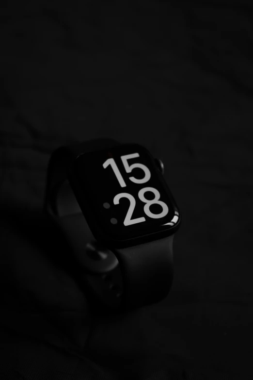 the watch is black and has white numbers