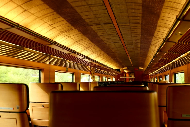 inside of a train with wooden and wire rails