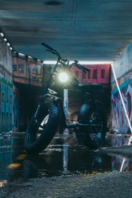 a motorcycle that is parked underneath some concrete