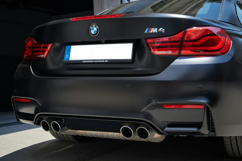 the back end of a black bmw car