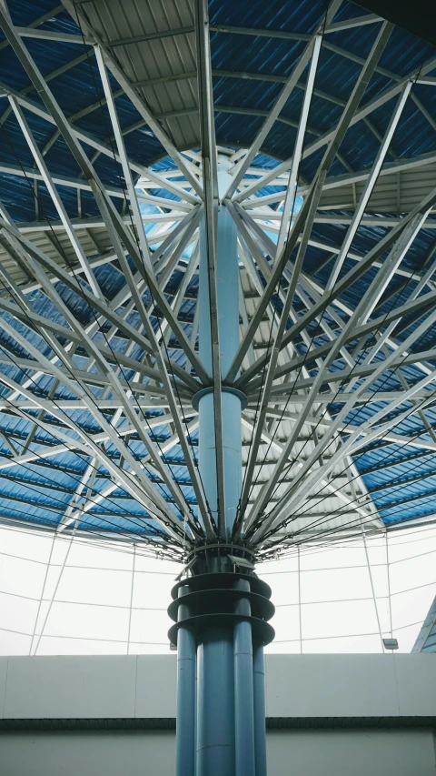 an indoor structure is seen with a blue roof