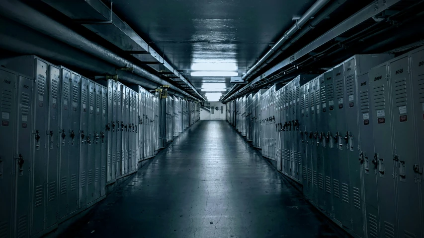 there is a long hallway with several rows of lockers