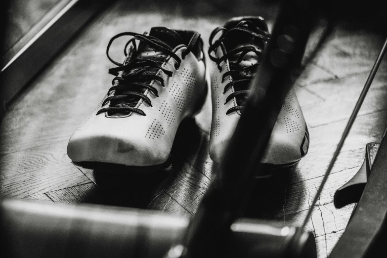 two pairs of skates are propped against one another