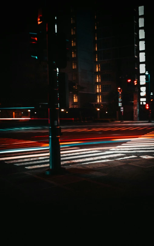 the lights of traffic in the city lit up at night