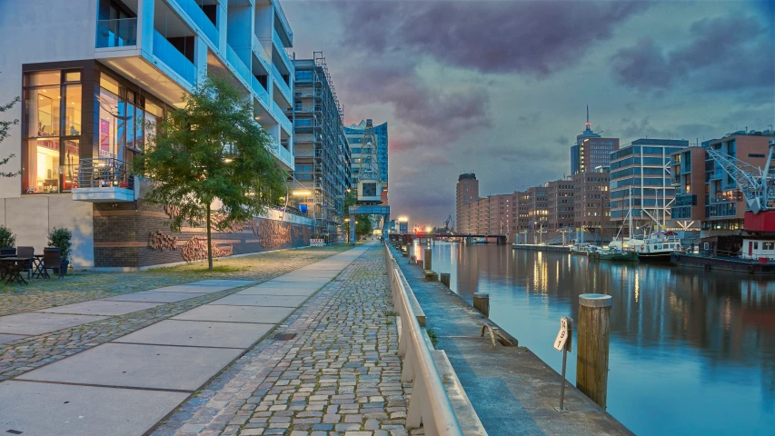 a brick path along a river at dusk