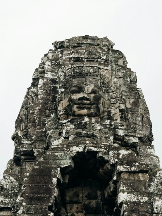 a large stone face in the middle of a building