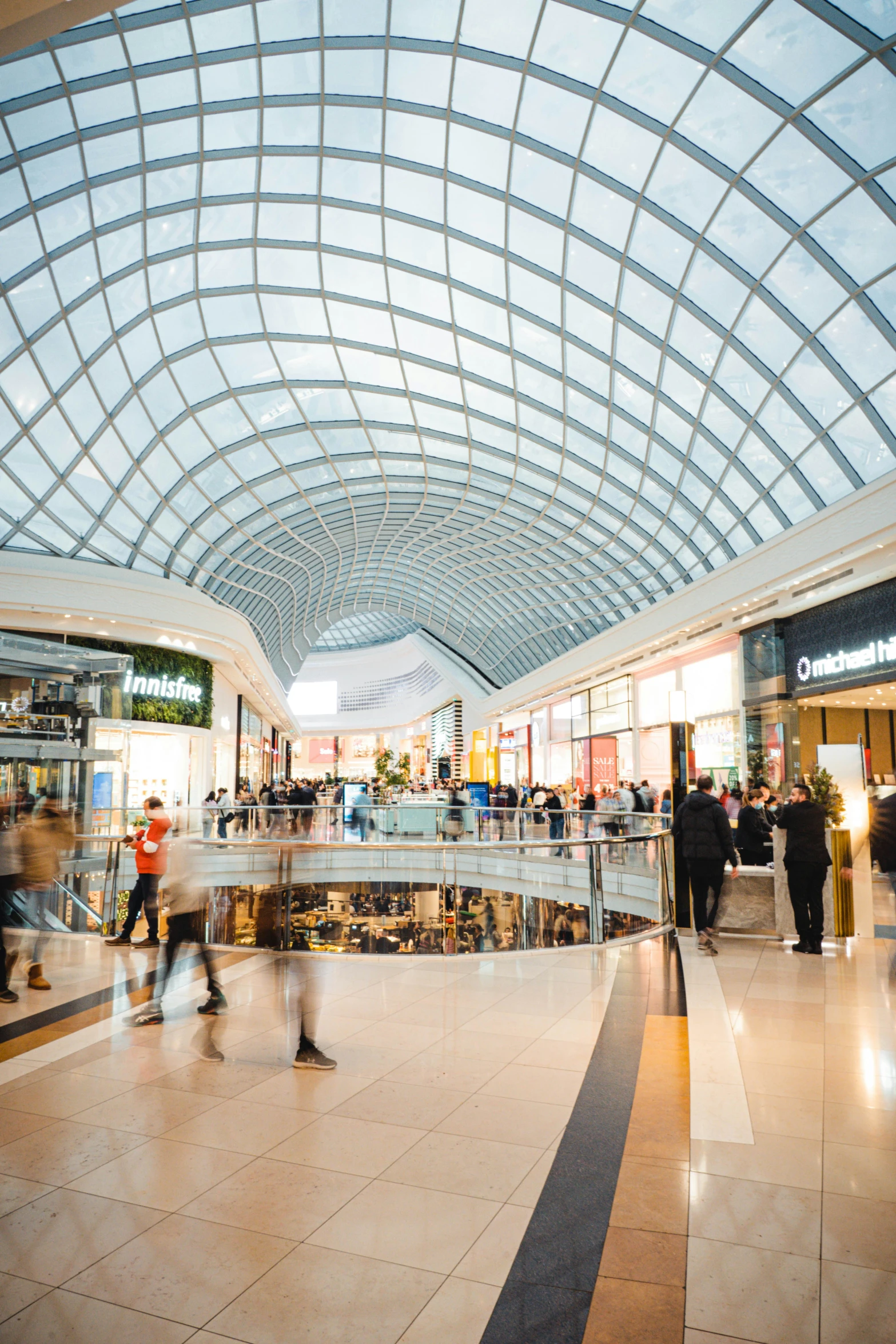 people are walking through the shopping mall