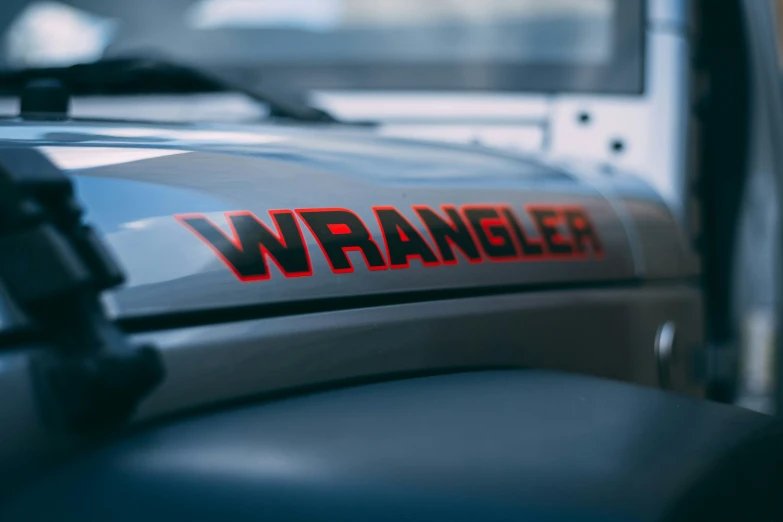 the words wrangler on the back of a pickup truck