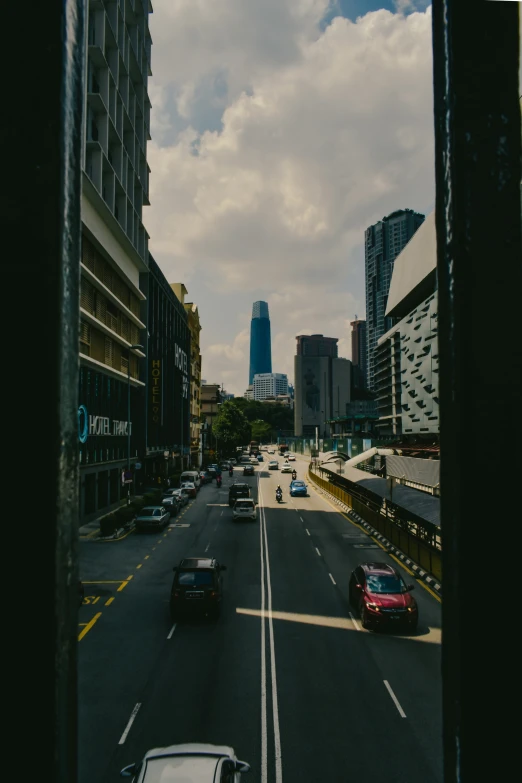 vehicles are traveling on an almost empty street