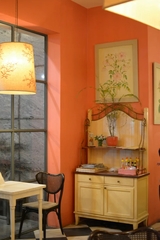 the interior of a living room painted in orange