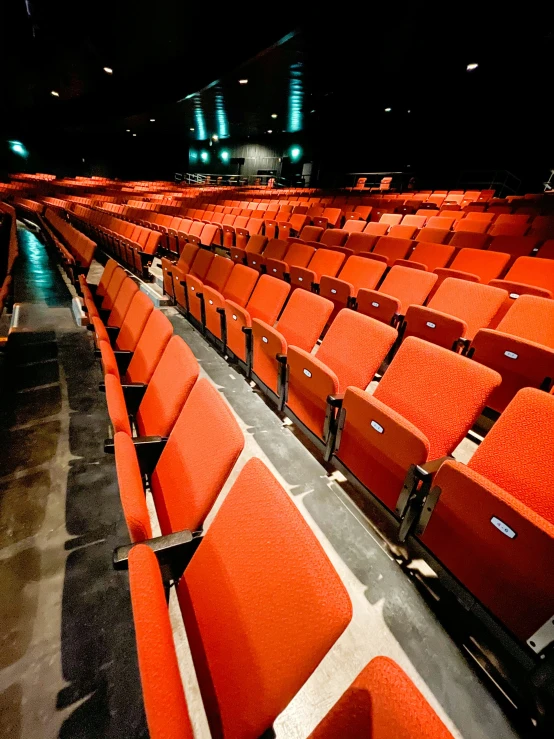 empty orange seats in an empty stadium or theatre