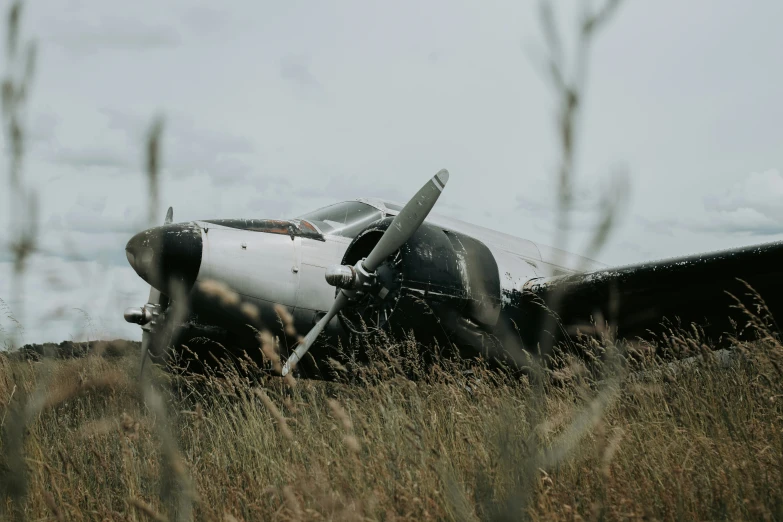 a large propeller plane that is on the ground