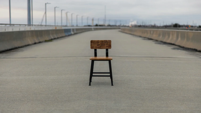 a chair sitting on top of a wooden bench