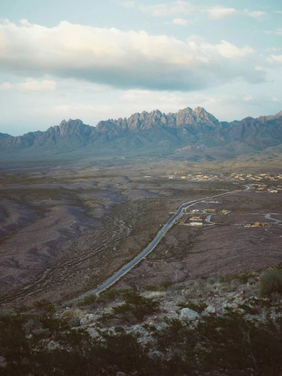 a long road in the middle of a mountain range