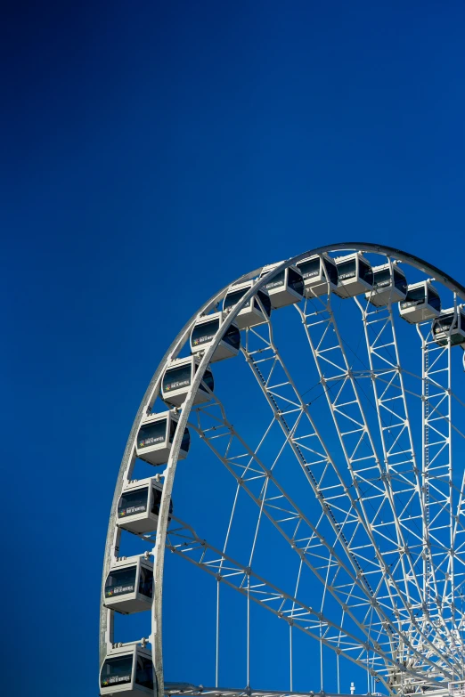 a very big ferris wheel with some people on it