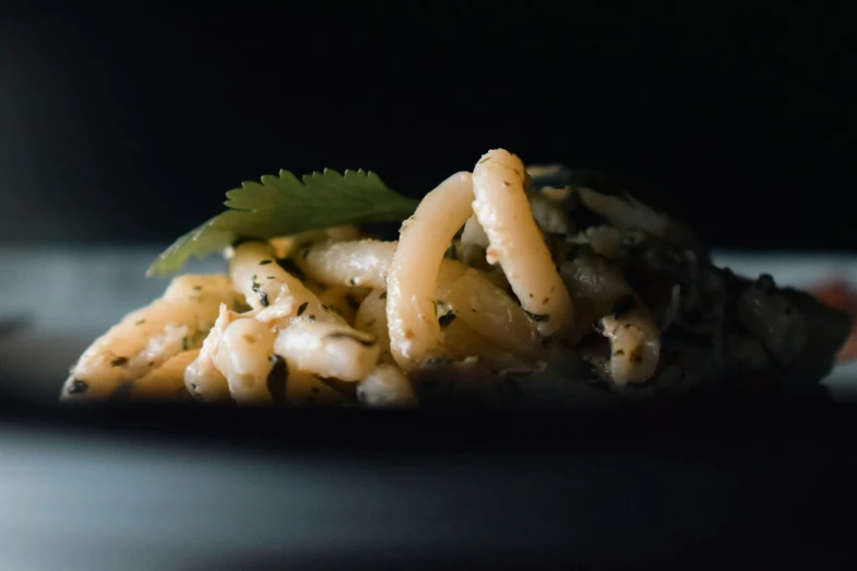 an asian dish with noodles and carrots served on a plate