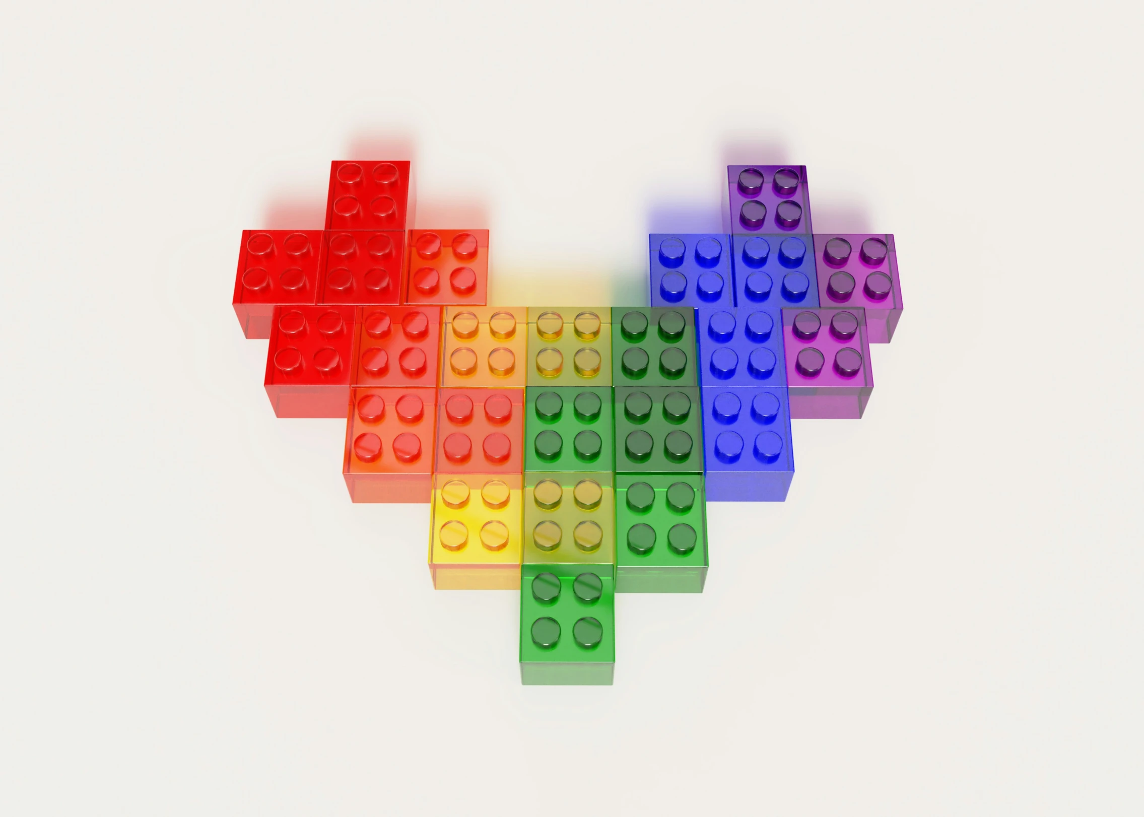 multi - colored heart made out of legos arranged in a rainbow