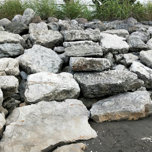 an outdoor area with large rocks that look like they have been used as a landscaping material