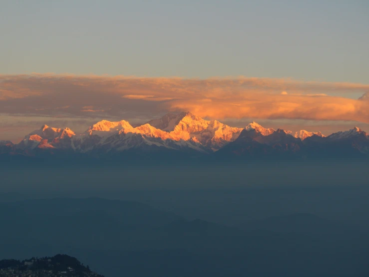 the view from the air of snow covered mountains