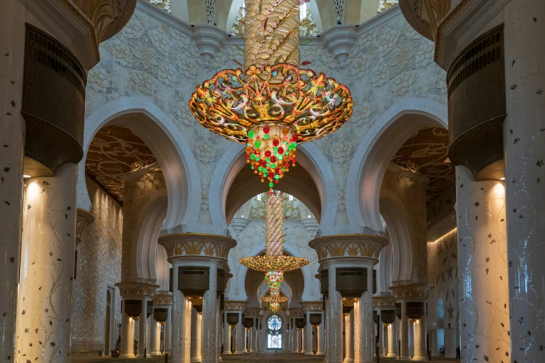 a chandelier hangs from the ceiling inside a building